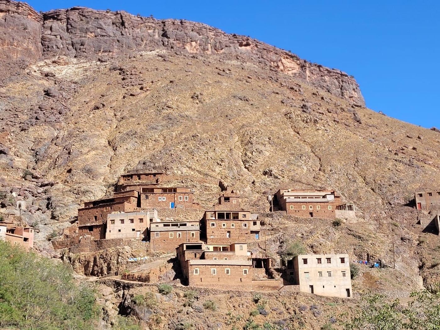 A Berber village built into a red hillside in the High Atlas